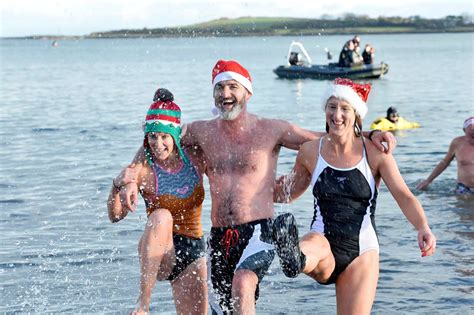 Boxing Day swim sees young and old plunge into the icy sea for charity ...