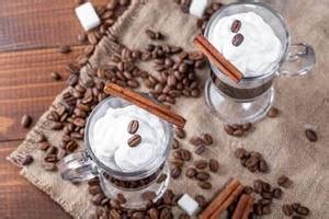 Three glass cups with prepared coffee, whole grains and ground coffee ...