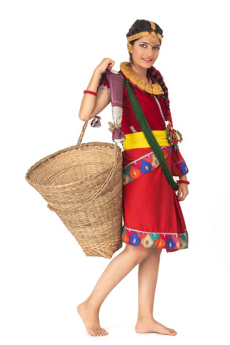 A traditional girl with cultural Bahun or Brahmin dress is carrying a ...