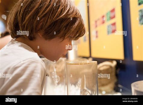 Little boy smelling oriental scents at Interpretive Center of Moriscos Culture in Hornachos ...