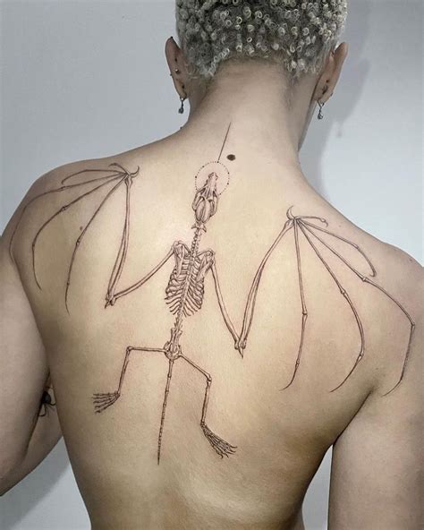 Doja Cat covers entire back with bat skeleton tattoo