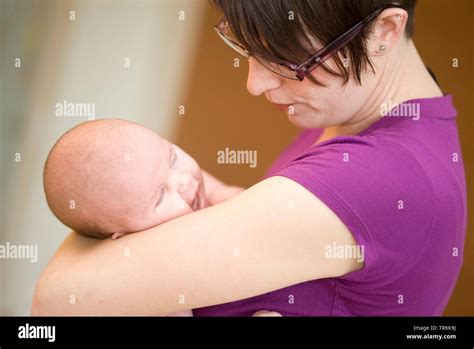 mother with crying baby Stock Photo - Alamy