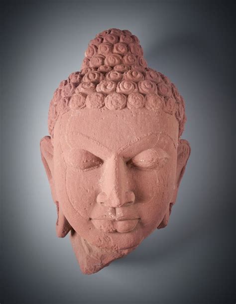 TÊTE DE BOUDDHA en grès rose sculpté - auctions & price archive