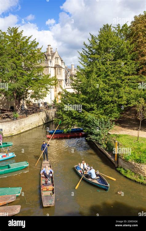 People punting on punts hired at Oxford Punting Magdalen Bridge Boathouse Magdalen College on ...