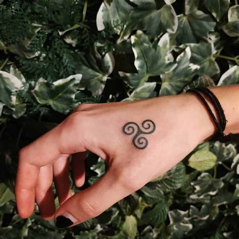 12 Triskelion Tattoo Designs with Meanings and Ideas - Body Art Guru