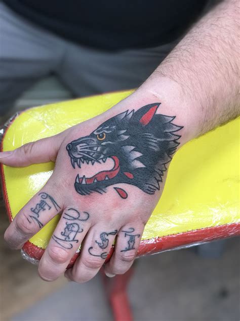 Traditional wolf head tattoo by Krooked Ken