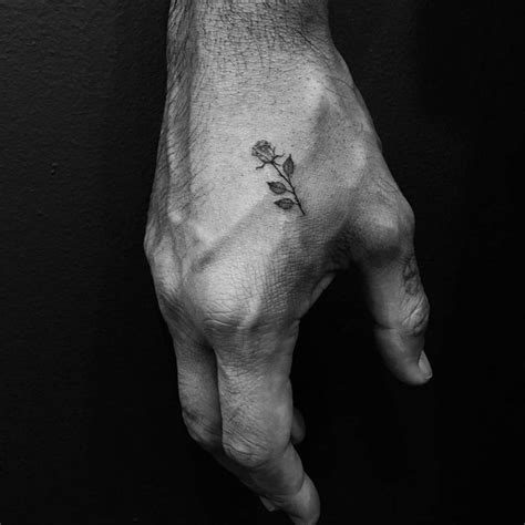 Tiny rose tattoo on the hand - Tattoogrid.net