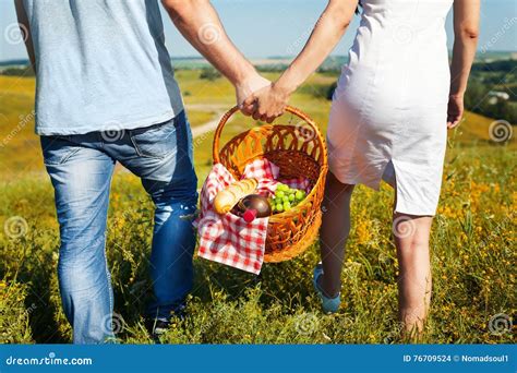 Young Couple Going with Picnic Basket Stock Photo - Image of romantic, people: 76709524