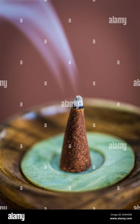 Burning incense cone Stock Photo - Alamy