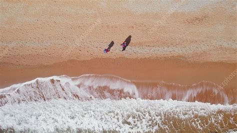 People walking along a beach, aerial - Stock Video Clip - K011/9667 ...