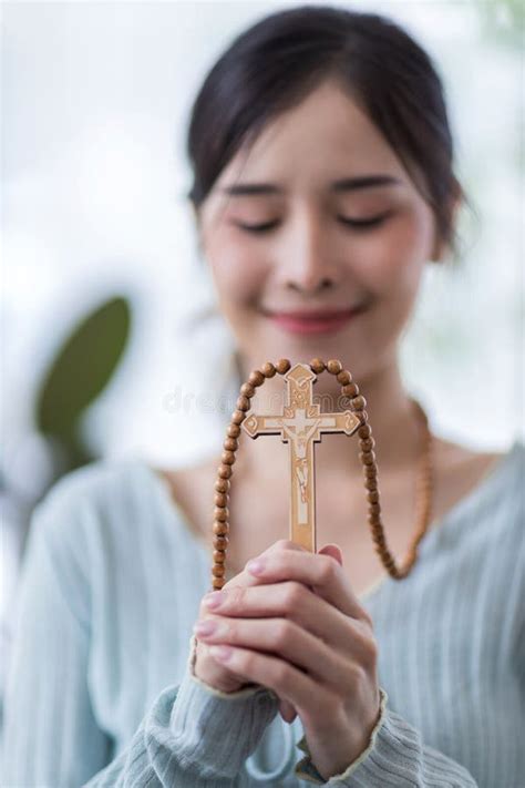 Woman in Religion Concept. Hands Praying To the GOD while Holding a Crucifix Symbol . Nun ...