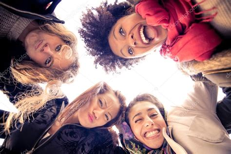 Four young beautiful girls smiling — Stock Photo © oneinchpunch #62731179