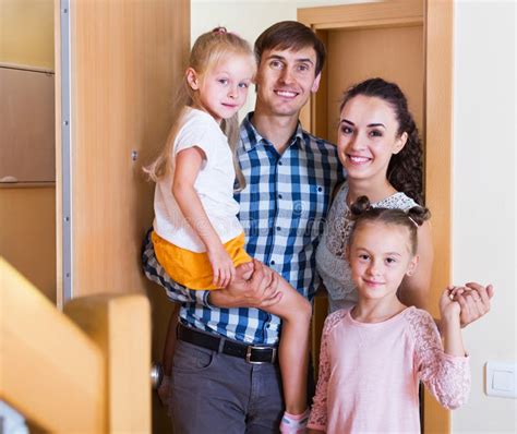 Middle Class Family in New House Stock Photo - Image of doorway ...