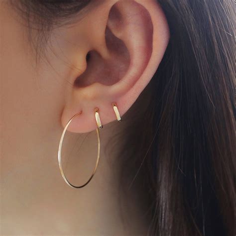 tiny 6mm hugging hoop earrings in second hole and third hole #GoldCoins | Diamond earrings studs ...