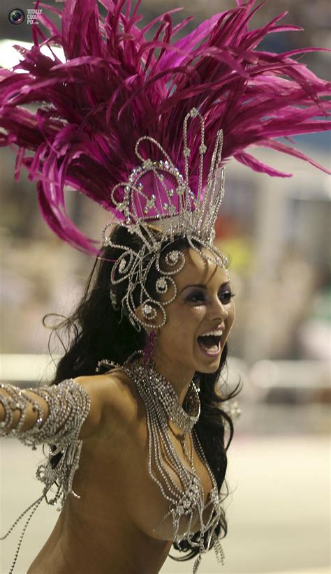 A model parades for the Camisa Verde e Branco Samba School during a carnival at Anhembi ...