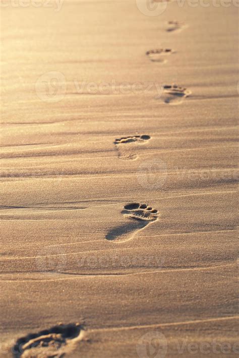 Footprints on the beach 1392238 Stock Photo at Vecteezy