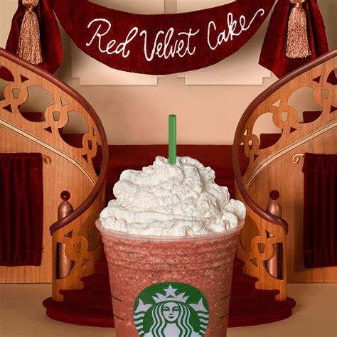 a starbucks drink with whipped cream and a green straw in front of a red velvet cake sign