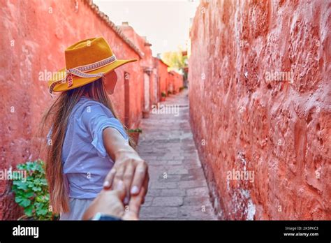 Couple holding hands in Santa Catalina Monastery, Convento de Santa Catalina, Arequipa, Peru ...