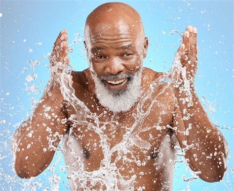 Premium Photo | Black man cleaning face water splash and skincare with beauty hygiene and facial ...