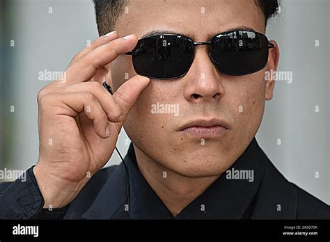 Security Guard Looking Wearing Sunglasses Stock Photo - Alamy