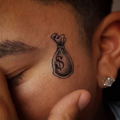 Explore the Meaning Behind Cool Money Tattoos - TattoosWin | Money bag tattoo, Face tattoos ...