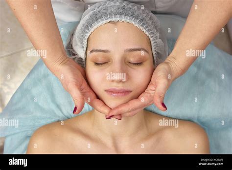 Facial massage top view Stock Photo - Alamy