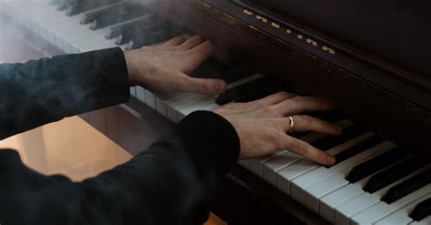 Person in Black Pants Playing Piano · Free Stock Photo