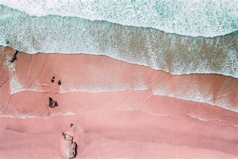 Aerial View of Ocean Waves and Beautiful Pink Sandy Beach Stock Image ...