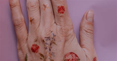 Photo of Flower Tattoos on Person's Left Hand · Free Stock Photo