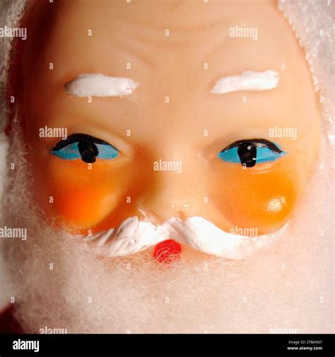 Close up a vintage Father Christmas tin toy. Full traditional Santa costume with trademark white ...