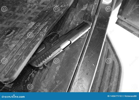 Handgun hidden in a car stock photo. Image of handgun - 143677110