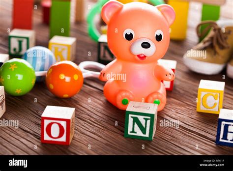 Pile of toys, collection on wooden background Stock Photo - Alamy