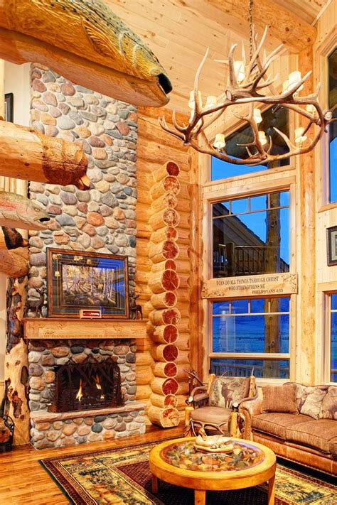 Photo of stone fireplace and living room inside a log home Home Fireplace, Fireplace Design ...