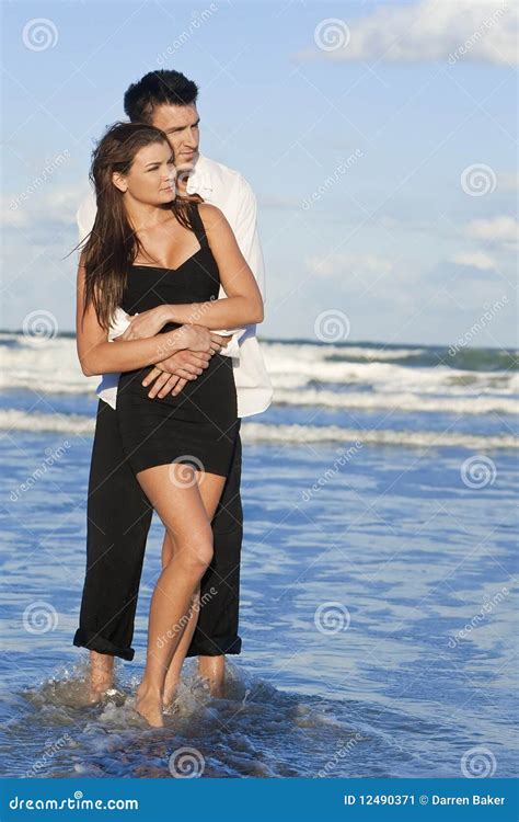 Man and Woman Couple in Romantic Embrace on Beach Stock Image - Image of embracing, vacation ...