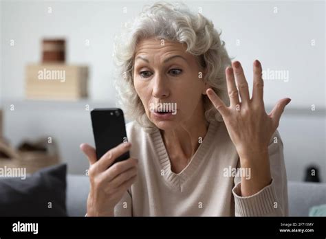 Old lady angry phone hi-res stock photography and images - Alamy