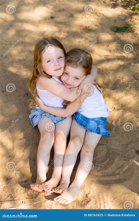 Two Little Girl Girl Friends Hugging in the Forest Stock Image - Image of girlfriends, long ...