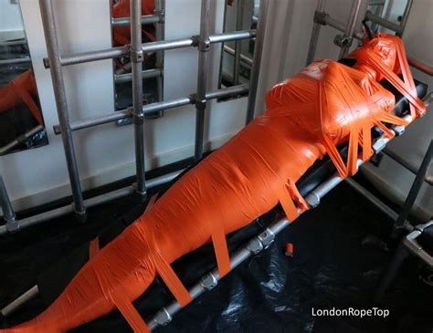 Mummification in orange | mummy damsel | Pinterest | Latex, Wraps and Leather