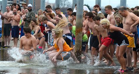 Thousands ring in the New Year with annual Polar Bear Plunge tradition | Daily Mail Online