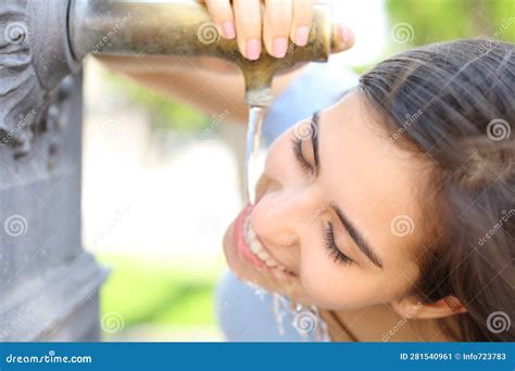 Happy Woman Drinking Water from Public Fountain Stock Image - Image of hydrating, diet: 281540961