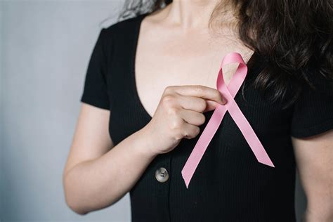 Woman Holding Pink Ribbon · Free Stock Photo