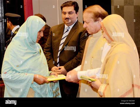 Prime Minister Muhammad Nawaz Sharif handing over Health Card to a ...