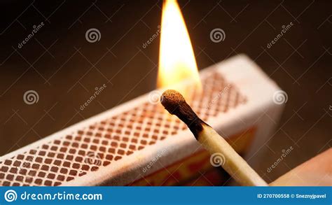 Match is Lit from a Matchbox. Close-up of a Wooden Match Stock Photo ...