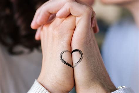 Aggregate 89+ love symbol tattoos for couples - esthdonghoadian