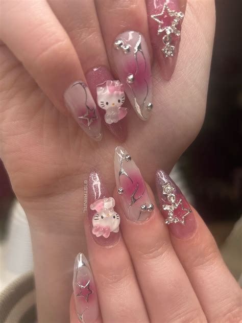 Milky white aura nails with chrome lines and pearls with hello kitty and rhinestone charms Pink ...