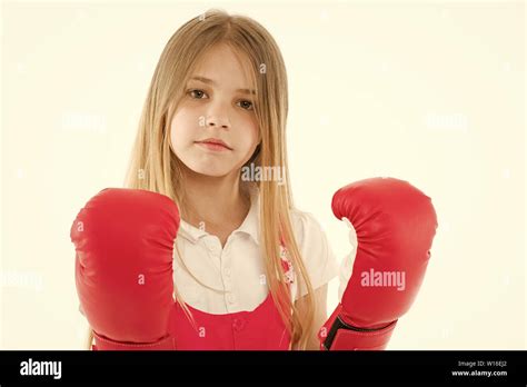 Punching. Childhood development and health. Success. Adorable boxer isolated on white. Fitness ...