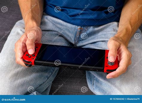 Man Sitting on Sofa and Playing Nintendo Switch Video Game Console Editorial Photography - Image ...