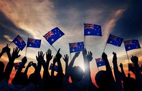 Group Of People Waving Australian Flags In Back Lit Stock Photo - Image: 44545377