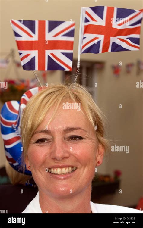 Young woman wearing union jack flags for the celebrations of the Queen's Diamond Jubilee ...
