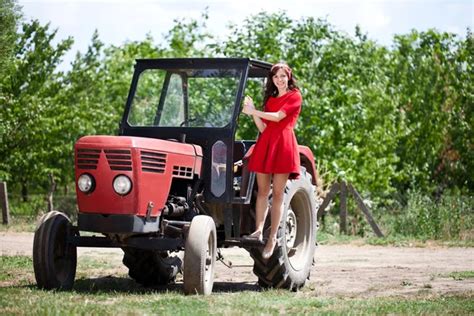 Country girl on tractor — Stock Photo © luckybusiness #12297466