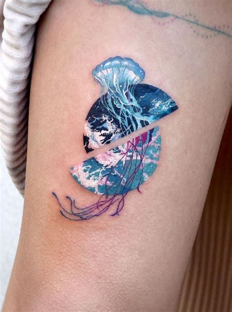 a woman's arm with a tattoo on it that has jellyfish in the water